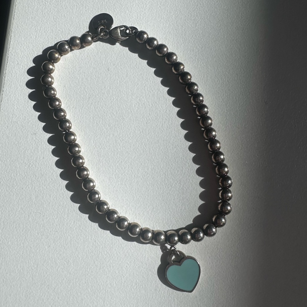 Tiffany silver blue heart bracelet.